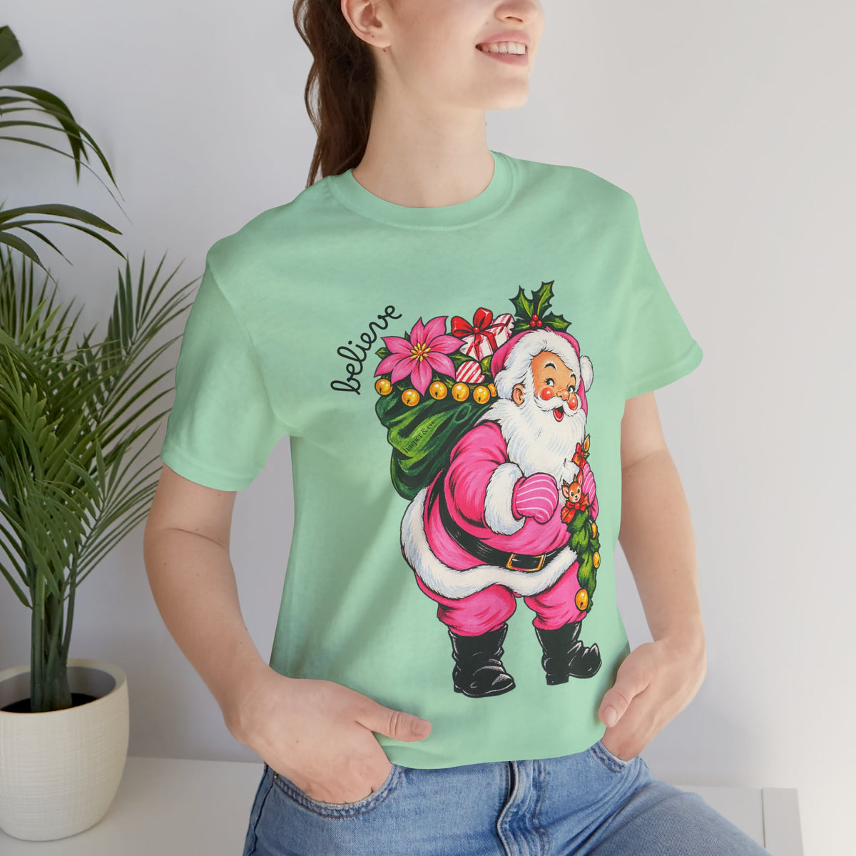 Pink Santa Christmas T-Shirt — Retro Holiday Santa Carrying Poinsettias Tee