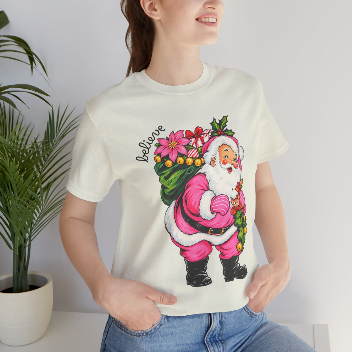 Pink Santa Christmas T-Shirt — Retro Holiday Santa Carrying Poinsettias Tee