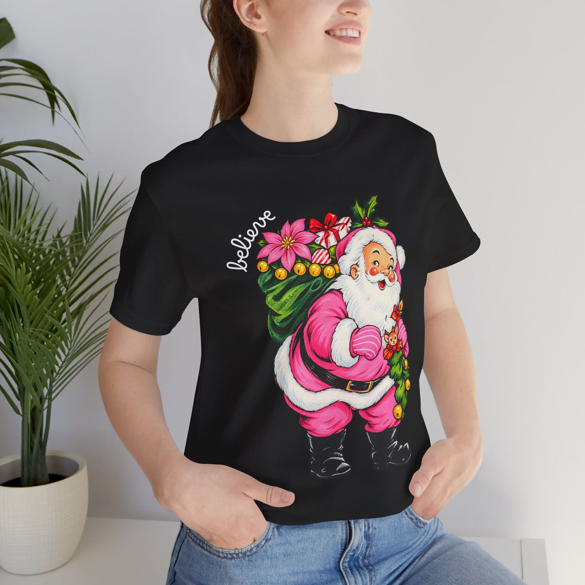 Pink Santa Christmas T-Shirt — Retro Holiday Santa Carrying Poinsettias Tee
