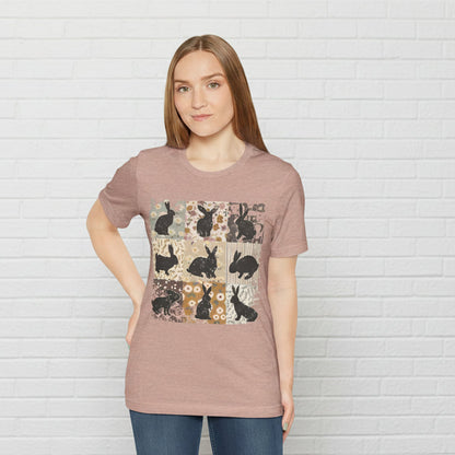 Woman wearing a brown t-shirt with rabbit pattern on a white background